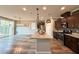 Open-concept kitchen boasts a center island, stainless steel appliances, and seamless flow to the living area at 2922 Tranquil Brook Ave, Henderson, NV 89044