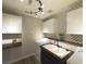 Clean laundry area with a sink, modern appliances, lighting fixtures, and ample counter space at 2922 Tranquil Brook Ave, Henderson, NV 89044