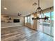 Bright living room features wood floors, recessed lighting, and sliding glass doors to the backyard at 2922 Tranquil Brook Ave, Henderson, NV 89044