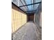 Narrow side yard featuring pea gravel and brick edging, offering low-maintenance landscaping at 2922 Tranquil Brook Ave, Henderson, NV 89044