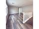Open staircase leading to the upper level, showcasing the open floor plan and natural light at 2922 Tranquil Brook Ave, Henderson, NV 89044