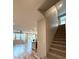Carpeted staircase leading to the upper level of the home, bathed in natural light at 2922 Tranquil Brook Ave, Henderson, NV 89044
