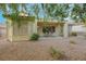 Desert landscaped backyard featuring a covered patio and seating area at 2969 Sumter Valley Cir, Henderson, NV 89052