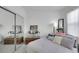Bedroom featuring mirrored closet, carpet, and a large window at 2969 Sumter Valley Cir, Henderson, NV 89052