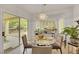 Bright dining area features a chandelier, sliding glass door, and space for seating four at 2969 Sumter Valley Cir, Henderson, NV 89052