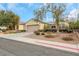 Charming single story home featuring desert landscaping, a tile roof, and an attached two car garage at 2969 Sumter Valley Cir, Henderson, NV 89052