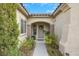 Inviting entryway with covered porch and tasteful landscaping creates a warm welcome to this lovely home at 2969 Sumter Valley Cir, Henderson, NV 89052