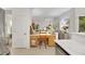 Bright kitchen with dedicated desk space, tile floors, stainless steel appliances, and white trim at 2969 Sumter Valley Cir, Henderson, NV 89052