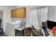 Bright laundry room with cabinets, washer, dryer, desk, and window at 2969 Sumter Valley Cir, Henderson, NV 89052