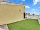 Artificial turf in backyard creates a lush, low-maintenance outdoor space for relaxation at 3308 Paragon Dr, Las Vegas, NV 89117