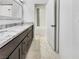 Elegant bathroom featuring marble countertops, modern fixtures, and a shower-tub combination at 3308 Paragon Dr, Las Vegas, NV 89117