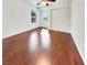 Bright, airy bedroom with hardwood floors, a large window, and a closet at 3308 Paragon Dr, Las Vegas, NV 89117