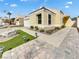 Charming home featuring a two-car garage, desert landscaping, and a welcoming front yard at 3308 Paragon Dr, Las Vegas, NV 89117