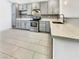Modern kitchen featuring stainless steel appliances, stylish backsplash, ample cabinet space, and a breakfast bar at 3308 Paragon Dr, Las Vegas, NV 89117