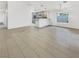 Bright and airy living room featuring tile floors and an open layout to the kitchen and dining areas at 3308 Paragon Dr, Las Vegas, NV 89117