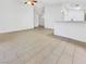 Bright living room features tile flooring and neutral paint, creating a clean and welcoming space at 3308 Paragon Dr, Las Vegas, NV 89117