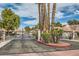 Gated community entrance featuring lush landscaping, adding security and curb appeal to the neighborhood at 3609 Laguna Del Sol Dr, Las Vegas, NV 89121