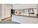Kitchen with white cabinets, light countertops, stainless steel appliances, and wood floor at 3609 Laguna Del Sol Dr, Las Vegas, NV 89121