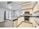 Modern kitchen featuring white cabinets, stainless steel appliances, and a breakfast bar at 3609 Laguna Del Sol Dr, Las Vegas, NV 89121