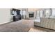 Living room featuring a large tv, fireplace, cozy couch, and lots of carpet at 3609 Laguna Del Sol Dr, Las Vegas, NV 89121
