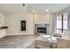 Open-concept living room with a stone fireplace, recessed lighting, and access to the kitchen area at 3609 Laguna Del Sol Dr, Las Vegas, NV 89121