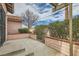 Cozy patio area with brick accents and mature landscaping, creating a private and relaxing outdoor space at 3609 Laguna Del Sol Dr, Las Vegas, NV 89121