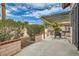 Charming backyard patio featuring a pergola, perfect for outdoor seating and relaxing in a private setting at 3609 Laguna Del Sol Dr, Las Vegas, NV 89121
