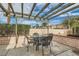 View of the outdoor patio featuring stylish furniture with a pergola overhead, perfect for entertainment at 3609 Laguna Del Sol Dr, Las Vegas, NV 89121