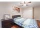 Cozy bedroom featuring a comfortable bed, dark dresser, closet, and tasteful decor at 4097 Nook Way # A, Las Vegas, NV 89103