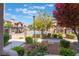 Charming community pool area with a view of lush greenery and well-kept building exteriors at 4097 Nook Way # A, Las Vegas, NV 89103
