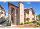 Charming condo exterior with a tile roof, red rock landscaping, and private stair access at 4097 Nook Way # A, Las Vegas, NV 89103