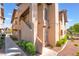 Charming condo exterior with stairs, tile roof, and desert landscaping at 4097 Nook Way # A, Las Vegas, NV 89103