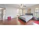 Expansive main bedroom boasting hardwood floors, arched windows, and an ensuite bath access at 4097 Nook Way # A, Las Vegas, NV 89103