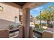 Scenic view of the community pool area and tan buildings, as seen from a stucco porch at 4097 Nook Way # A, Las Vegas, NV 89103