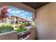 Scenic view of the community pool and landscaping, framed by the stucco architecture at 4097 Nook Way # A, Las Vegas, NV 89103