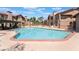 Large community pool with sun loungers and shade offers a relaxing oasis for residents at 4097 Nook Way # A, Las Vegas, NV 89103
