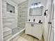 Modern bathroom featuring tile finishes, a shower, and vanity at 4324 El Conlon Ave, Las Vegas, NV 89102