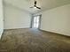 Spacious bedroom with plush carpeting and sliding glass door to outside at 4324 El Conlon Ave, Las Vegas, NV 89102
