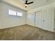 A basic bedroom featuring a window, closet and ceiling fan at 4324 El Conlon Ave, Las Vegas, NV 89102