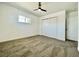 A basic bedroom featuring a window, closet and ceiling fan at 4324 El Conlon Ave, Las Vegas, NV 89102