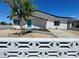 Charming single-story home with a quaint front yard and a bright teal front door at 4324 El Conlon Ave, Las Vegas, NV 89102