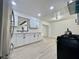 Bright kitchen with white cabinets, stainless steel appliances, and vinyl floors at 4324 El Conlon Ave, Las Vegas, NV 89102