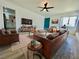 Staged living room featuring sleek furniture, a plush rug, and an entertainment center at 4324 El Conlon Ave, Las Vegas, NV 89102