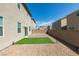 Backyard featuring a brick wall, gravel, and artificial turf for low maintenance outdoor living at 4642 Chirping St, North Las Vegas, NV 89031