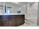 Well-lit bathroom with a large vanity, modern fixtures, and a shower-tub combination, offering functionality at 4642 Chirping St, North Las Vegas, NV 89031