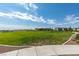Open community green space with manicured lawn, walking path, and covered picnic area at 4642 Chirping St, North Las Vegas, NV 89031