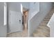 Bright foyer featuring stairs to the upper level and a view of the entryway at 4642 Chirping St, North Las Vegas, NV 89031