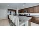 Bright and open kitchen with granite counters, stainless appliances and a large kitchen island at 4642 Chirping St, North Las Vegas, NV 89031