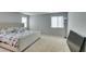 Bright and spacious bedroom with a large bed, neutral walls, and ample natural light from multiple windows at 4642 Chirping St, North Las Vegas, NV 89031