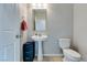 Well-lit powder room featuring a pedestal sink and neutral wall color at 4642 Chirping St, North Las Vegas, NV 89031
